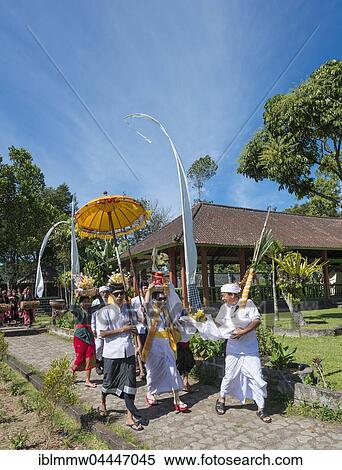 Procession of devout Buddhists with offerings, at Pura Ulun Danu Bratan water temple, Lake Bratan, Bali, Indonesia, Asia View Large Photo Image Stock Photography - Procession of devout Buddhists with offerings, at Pura Ulun Danu Bratan water temple, Lake Bratan, Bali, Indonesia, Asia. Fotosearch