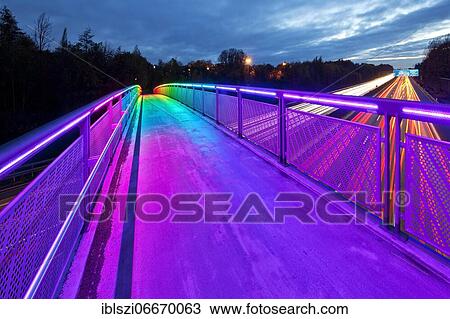 Stock Image - Rainbow bridge over the motorway A 40 in the evening, Dortmund, Ruhr area, North Rhine-Westphalia, Germany, Europe. Fotosearch