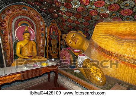 Reclining Buddha statue, painted ceilings, statues, Aluvihara Rock Cave Temple, Central Province, Sri Lanka, Asia View Large Photo Image Stock Photo - Reclining Buddha statue, painted ceilings, statues, Aluvihara Rock Cave Temple, Central Province, Sri Lanka, Asia. Fotosearch