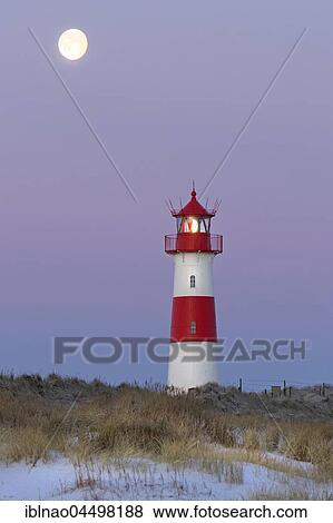 Red and white striped lighthouse List East in the dunes at the full moon, twilight Ellenbogen, List, Sylt, North Frisia, Schleswig-Holstein, Germany, Europe View Large Photo Image Stock Photo - Red and white striped lighthouse List East in the dunes at the full moon, twilight Ellenbogen, List, Sylt, North Frisia, Schleswig-Holstein, Germany, Europe. Fotosearch