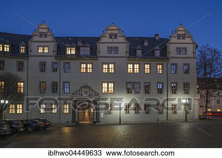 Stock Image - Red Castle, part of Duchess Anna Amalia Library, historic façade with entrance, night scene, Weimar, Thuringia, Germany, Europe. Fotosearch
