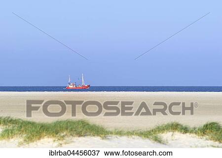 Red fishing boat in the North Sea, St. Peter-Ording Beach, Schleswig-Holstein Wadden Sea National Park, North Frisia, Schleswig-Holstein, Germany, Europe View Large Photo Image Stock Photo - Red fishing boat in the North Sea, St. Peter-Ording Beach, Schleswig-Holstein Wadden Sea National Park, North Frisia, Schleswig-Holstein, Germany, Europe. Fotosearch