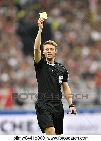 Referee Christian Dingert displays yellow card, warning, Mercedes-Benz Arena, Stuttgart, Baden-Württemberg, Germany, Europe View Large Photo Image Stock Image - Referee Christian Dingert displays yellow card, warning, Mercedes-Benz Arena, Stuttgart, Baden-Württemberg, Germany, Europe. Fotosearch