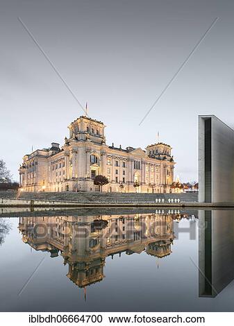 Stock Image - Reichstag with waving German flag at the Spree, government quarter, Berlin, Germany, Europe. Fotosearch
