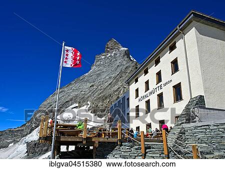 Renovated Hörnlihütte and Valais canton flag at the Matterhorn, Zermatt, Canton of Valais, Switzerland, Europe View Large Photo Image Stock Image - Renovated Hörnlihütte and Valais canton flag at the Matterhorn, Zermatt, Canton of Valais, Switzerland, Europe. Fotosearch