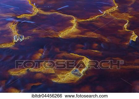 Rio Tinto, Red river, detail with oxidised iron minerals in water, Huelva province, Andalusia, Spain, Europe View Large Photo Image Stock Photograph - Rio Tinto, Red river, detail with oxidised iron minerals in water, Huelva province, Andalusia, Spain, Europe. Fotosearch