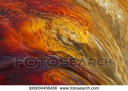 Stock Photograph - Rio Tinto, Red river, detail with oxidised iron minerals in water, Huelva province, Andalusia, Spain, Europe. Fotosearch