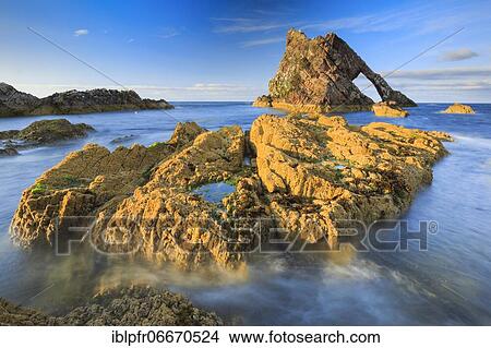 Rock arch on Scottish coast, Scotland, Great Britain View Large Photo Image Picture - Rock arch on Scottish coast, Scotland, Great Britain. Fotosearch
