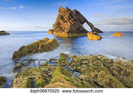 Rock arch on Scottish coast, Scotland, Great Britain View Large Photo Image Stock Photography - Rock arch on Scottish coast, Scotland, Great Britain. Fotosearch