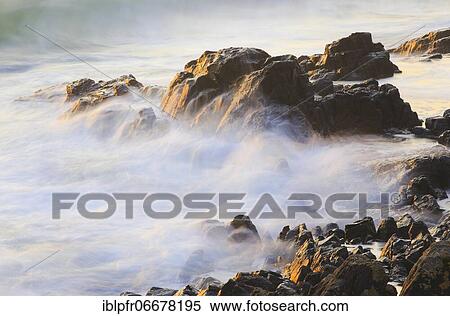 Rocks and waves on the sea coast near Bamburgh, Great Britain View Large Photo Image Stock Photography - Rocks and waves on the sea coast near Bamburgh, Great Britain. Fotosearch
