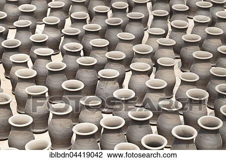 Rows of pots drying in the sun in potters square, Bhaktapur, Nepal, Asia View Large Photo Image Stock Image - Rows of pots drying in the sun in potters square, Bhaktapur, Nepal, Asia. Fotosearch