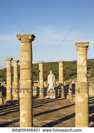 Ruins with statue of emperor Trajano, archeological site Baelo Claudia, Bolonia, Cadiz Province, Costa de la Luz, Andalusia, Spain, Europe View Large Photo Image Stock Image - Ruins with statue of emperor Trajano, archeological site Baelo Claudia, Bolonia, Cadiz Province, Costa de la Luz, Andalusia, Spain, Europe. Fotosearch