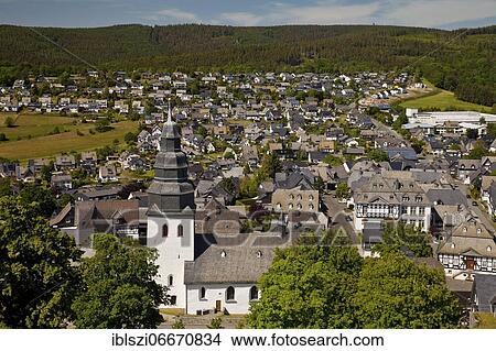 Saint John the Evangelist Church with village view, Eversberg, Meschede, Sauerland, North Rhine-Westphalia, Germany, Europe View Large Photo Image Picture - Saint John the Evangelist Church with village view, Eversberg, Meschede, Sauerland, North Rhine-Westphalia, Germany, Europe. Fotosearch