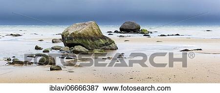 Sandy beach beach with boulders, stones on the beach of the Baltic Sea, dark clouds, Wismar Bay, near Wismar, Mecklenburg-Western Pomerania, Germany, Europe View Large Photo Image Stock Photo - Sandy beach beach with boulders, stones on the beach of the Baltic Sea, dark clouds, Wismar Bay, near Wismar, Mecklenburg-Western Pomerania, Germany, Europe. Fotosearch