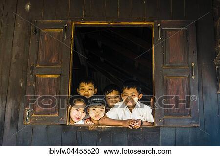 School children look curiously out of the window, Palaung hilltribe, Palaung Village in Kyaukme, Shan State, Myanmar, Asia View Large Photo Image Stock Image - School children look curiously out of the window, Palaung hilltribe, Palaung Village in Kyaukme, Shan State, Myanmar, Asia. Fotosearch