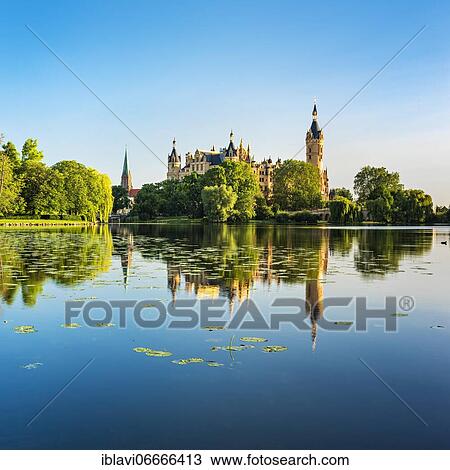Schwerin Castle at Schwerin Lake, water reflection with water lilies, Schwerin Cathedral on the left, Schwerin, Mecklenburg-Western Pomerania, Germany, Europe View Large Photo Image Stock Image - Schwerin Castle at Schwerin Lake, water reflection with water lilies, Schwerin Cathedral on the left, Schwerin, Mecklenburg-Western Pomerania, Germany, Europe. Fotosearch