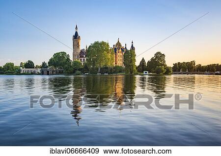 Schwerin Castle reflected in Schwerin Lake in the evening light, Schwerin, Mecklenburg-Western Pomerania, Germany, Europe View Large Photo Image Stock Photo - Schwerin Castle reflected in Schwerin Lake in the evening light, Schwerin, Mecklenburg-Western Pomerania, Germany, Europe. Fotosearch
