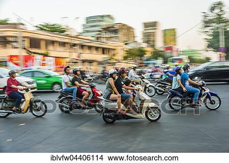 Picture - Scooter drivers in heavy traffic, motion blur, Ho Chi Minh City, Vietnam, Asia. Fotosearch