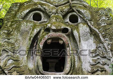 Stock Image - Sculpture of Orcus mouth, Sacro Bosco, Park of the Monsters, Bormazo, Viterbo, Italy, Europe. Fotosearch
