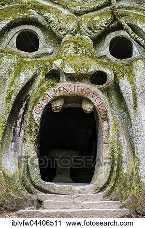 Stock Image - Sculpture of Orcus mouth, Sacro Bosco, Park of the Monsters, Bormazo, Viterbo, Italy, Europe. Fotosearch