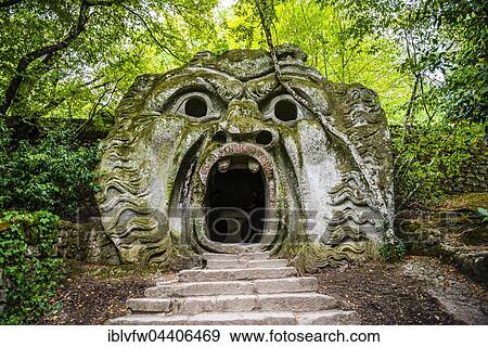 Sculpture of Orcus mouth, Sacro Bosco, Park of the Monsters, Bormazo, Viterbo, Italy, Europe View Large Photo Image Stock Photo - Sculpture of Orcus mouth, Sacro Bosco, Park of the Monsters, Bormazo, Viterbo, Italy, Europe. Fotosearch