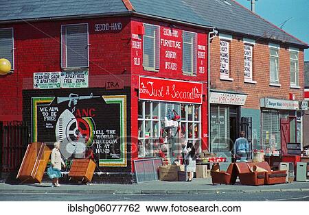 Stock Image - Second hand shop, Falls Road quarter, historic photograph, 08. 09. 1986, Belfast, Northern Ireland. Fotosearch