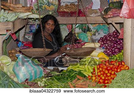 Seller with scale, fruit market, Hikkaduwa, Sri Lanka, Asia View Large Photo Image Stock Photo - Seller with scale, fruit market, Hikkaduwa, Sri Lanka, Asia. Fotosearch