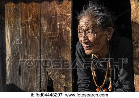 Senior female farmer looking out of a window, Ghyaru, Manang, Nepal, Asia View Large Photo Image Stock Photo - Senior female farmer looking out of a window, Ghyaru, Manang, Nepal, Asia. Fotosearch