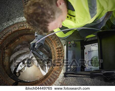 Sewer cleaning, inspection with video probe, worker looking at screen, Innsbruck, Tyrol, Austria, Europe View Large Photo Image Stock Photography - Sewer cleaning, inspection with video probe, worker looking at screen, Innsbruck, Tyrol, Austria, Europe. Fotosearch