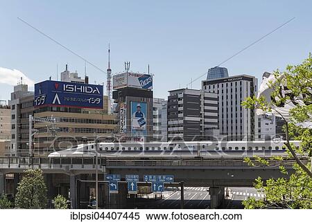 Shinkansen bullet train on a bridge in Shiodome, Minato, Tokyo, Japan, Asia View Large Photo Image Stock Photography - Shinkansen bullet train on a bridge in Shiodome, Minato, Tokyo, Japan, Asia. Fotosearch