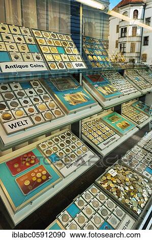 Stock Image - Showcase with different coin collections, numismatics shop, Bavaria, Germany, Europe. Fotosearch