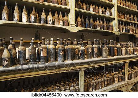 Stock Image - Showroom with old dust covered sherry bottles, winery Bodega Gonzalez Byass, Jerez de la Frontera, Cadiz province, Andalusia, Spain, Europe. Fotosearch