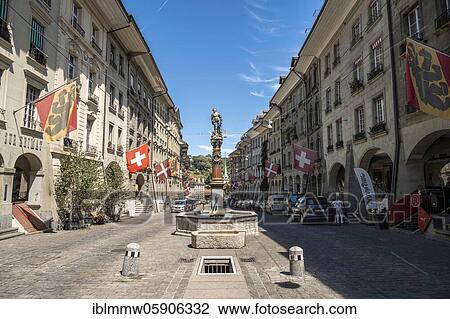 Stock Image - Simson fountain, flags on houses in the old town of Bern, Innere Stadt, Bern, Canton Bern, Switzerland, Europe. Fotosearch