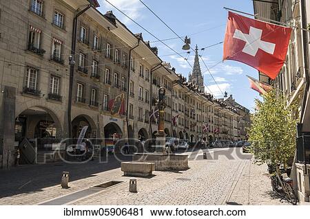 Simson fountain, flags on row of houses in the old town of Bern, behind Bern Cathedral, Inner City, Bern, Canton Bern, Switzerland, Europe View Large Photo Image Stock Image - Simson fountain, flags on row of houses in the old town of Bern, behind Bern Cathedral, Inner City, Bern, Canton Bern, Switzerland, Europe. Fotosearch