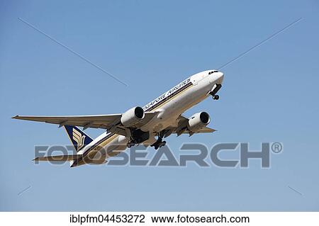 Stock Image - Singapore Airlines, Boeing 777, MSN 30872, after take off, in flight. Fotosearch