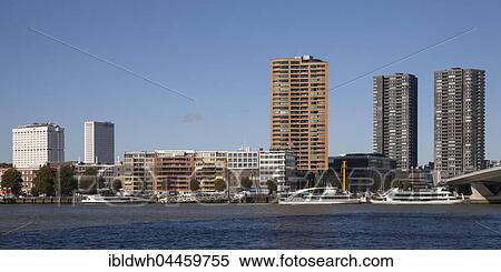 Stock Photography - Skyscrapers and pier at quay, Nieuwe Maas River, Rotterdam, Holland, Netherlands. Fotosearch