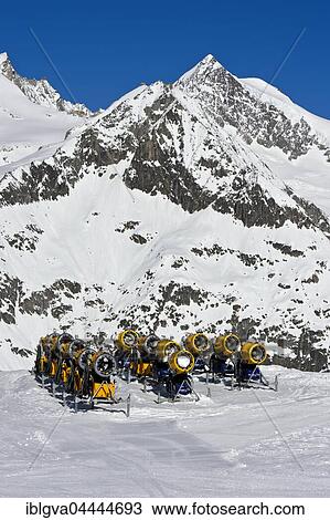 Snow cannons on ski slope, Aletsch Arena ski resort, Bettmeralp, Valais Canton, Switzerland, Europe View Large Photo Image Stock Image - Snow cannons on ski slope, Aletsch Arena ski resort, Bettmeralp, Valais Canton, Switzerland, Europe. Fotosearch