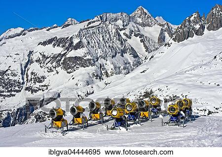 Snow cannons on ski slope, Aletsch Arena ski resort, Bettmeralp, Valais Canton, Switzerland, Europe View Large Photo Image Stock Photography - Snow cannons on ski slope, Aletsch Arena ski resort, Bettmeralp, Valais Canton, Switzerland, Europe. Fotosearch