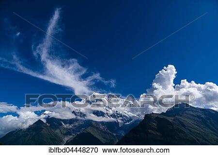 Snowcapped mountain Annapurna 2, covered in clouds, Upper Marsyangdi valley, Ghyaru, Manang District, Nepal, Asia View Large Photo Image Stock Image - Snowcapped mountain Annapurna 2, covered in clouds, Upper Marsyangdi valley, Ghyaru, Manang District, Nepal, Asia. Fotosearch