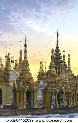 Stock Photo - Spires of Shwedagon pagoda, Shwedagon Paya, sunrise, Yangon, Myanmar, Asia. Fotosearch