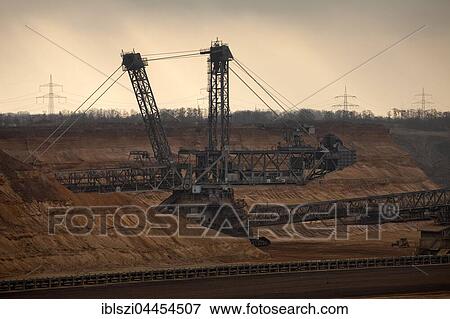 Spreader with tripper car, surface mining Hambach, Rhenish lignite mining area, North Rhine-Westphalia, Germany, Europe View Large Photo Image Stock Photo - Spreader with tripper car, surface mining Hambach, Rhenish lignite mining area, North Rhine-Westphalia, Germany, Europe. Fotosearch