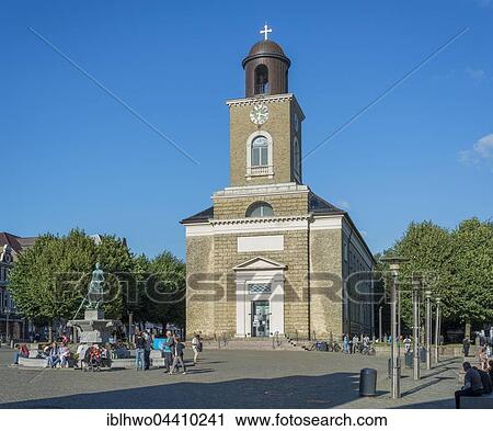 Stock Image - St. Mary's Church on the market square, 1833, with Tine Fountain, Husum, Schleswig-Holstein, Germany, Europe. Fotosearch