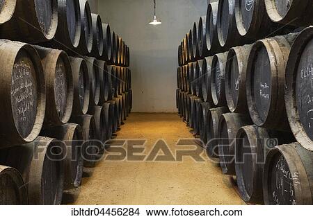Picture - Stacked oak barrels in wine cellar, winery Bodega Gonzalez Byass, Jerez de la Frontera, Cadiz province, Andalusia, Spain, Europe. Fotosearch