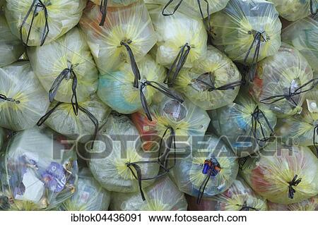 Stacked yellow bags with plastic waste, waste separation, Lower Saxony, Germany, Europe View Large Photo Image Stock Image - Stacked yellow bags with plastic waste, waste separation, Lower Saxony, Germany, Europe. Fotosearch