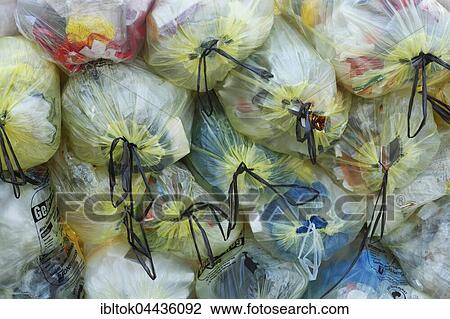 Stacked yellow bags with plastic waste, waste separation, Lower Saxony, Germany, Europe View Large Photo Image Stock Image - Stacked yellow bags with plastic waste, waste separation, Lower Saxony, Germany, Europe. Fotosearch