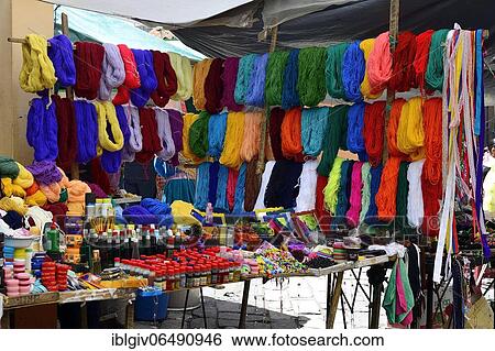Stock Photograph - Stall with colorful wool at the weekly market market, Tixán, Chimborazo Province, Ecuador, South America. Fotosearch