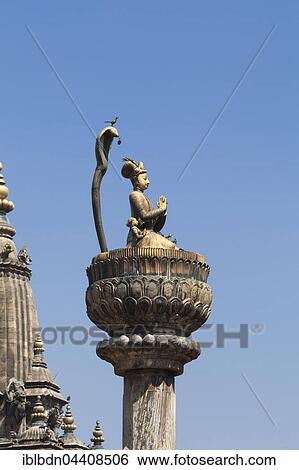 Stock Photograph - Statue of King Yoganarendra Malla with snake and bird, Durbar square, destroyed at earthquake April 2015, Patan, Nepal, Asia. Fotosearch