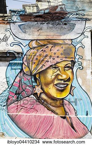 Street art, mural, woman carries ship on her head, Getsemani, District of La Matuna, Cartagena de Indias, Colombia, South America View Large Photo Image Picture - Street art, mural, woman carries ship on her head, Getsemani, District of La Matuna, Cartagena de Indias, Colombia, South America. Fotosearch