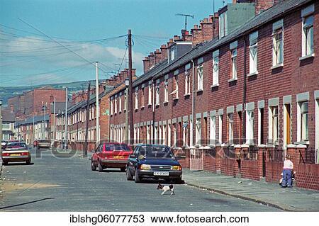 Stock Image - Street scene and terraced houses, Falls Road quarter, historic photograph, 08. 09. 1986, Belfast, Northern Ireland. Fotosearch