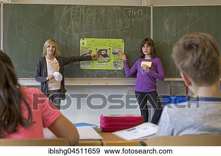 Students giving a presentation about Marco Polo, primary school, Lower Saxony, Germany, Europe View Large Photo Image Stock Photo - Students giving a presentation about Marco Polo, primary school, Lower Saxony, Germany, Europe. Fotosearch